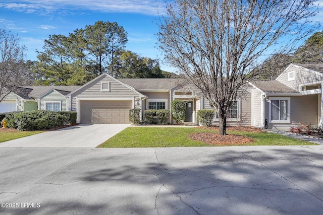 single story home featuring a garage and a front yard