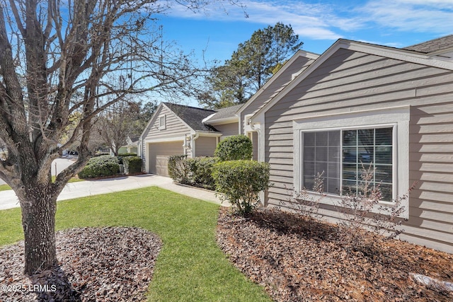 15 Padgett Dr, Bluffton, SC 29909 - view of property exterior featuring a garage and a lawn