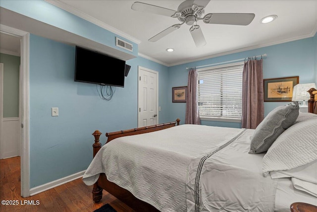 bedroom with ornamental molding, wood finished floors, and visible vents