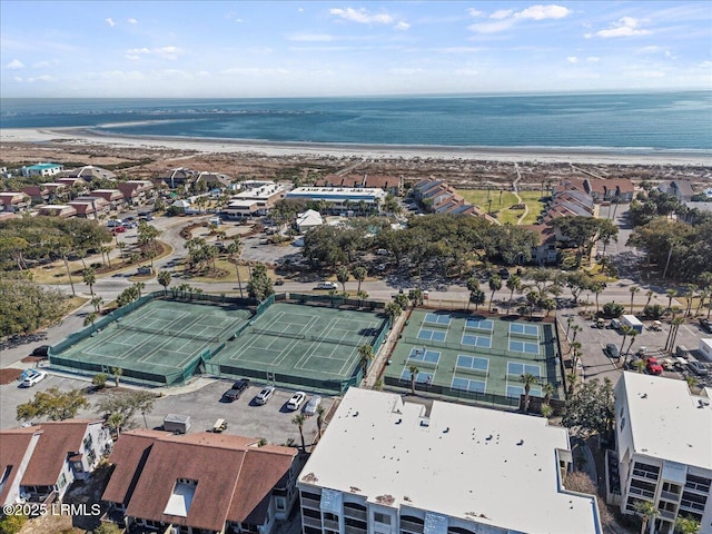 drone / aerial view with a beach view and a water view