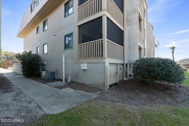 view of property exterior with central AC