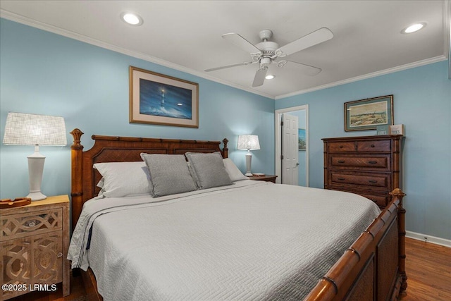 bedroom featuring baseboards, recessed lighting, wood finished floors, and crown molding