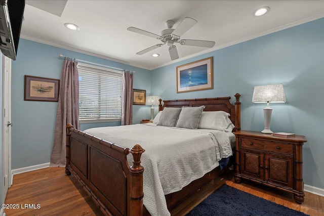 bedroom featuring baseboards, ornamental molding, wood finished floors, and recessed lighting