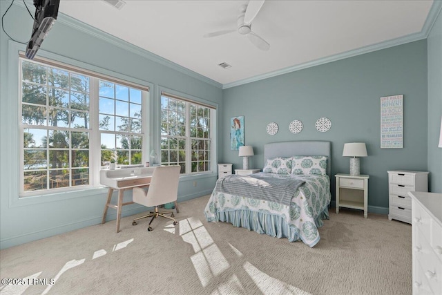 bedroom featuring multiple windows, ornamental molding, and ceiling fan