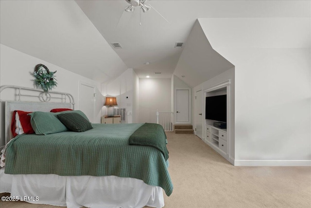 bedroom with ceiling fan, carpet floors, and vaulted ceiling