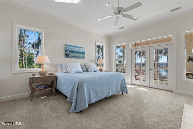 carpeted bedroom featuring access to exterior, crown molding, french doors, and ceiling fan