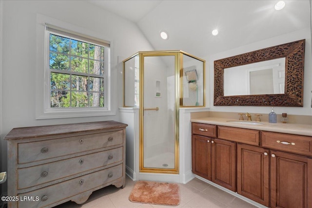 bathroom featuring vanity, tile patterned floors, and walk in shower