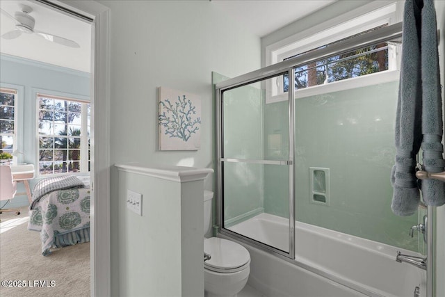 bathroom featuring bath / shower combo with glass door, ornamental molding, and toilet