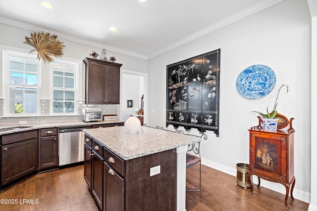 2712 Bluestem Dr, Beaufort, SC 29902 - kitchen with a center island, a kitchen breakfast bar, dishwasher, dark brown cabinetry, and dark wood-style flooring