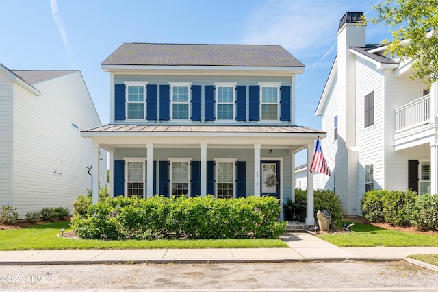 2712 Bluestem Dr, Beaufort, SC 29902 - colonial-style house with covered porch, a standing seam roof, and metal roof
