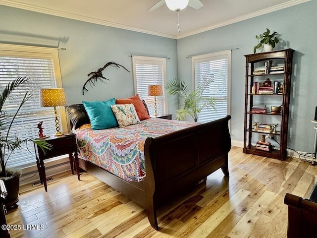 1118 Otter Cir, Beaufort, SC 29902 - bedroom featuring light wood finished floors, baseboards, crown molding, and a ceiling fan