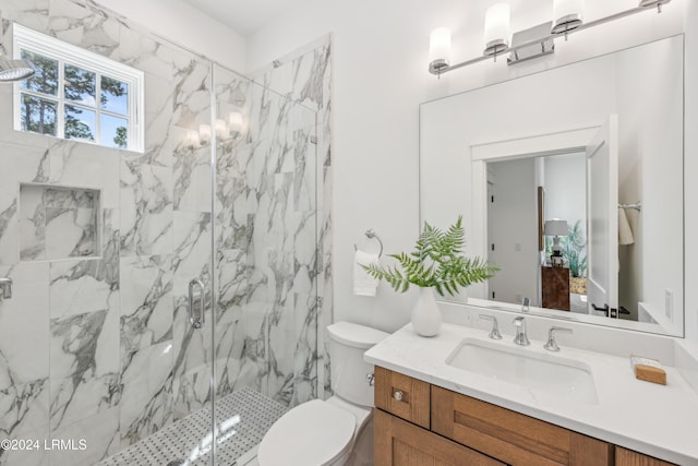 bathroom featuring walk in shower, vanity, and toilet