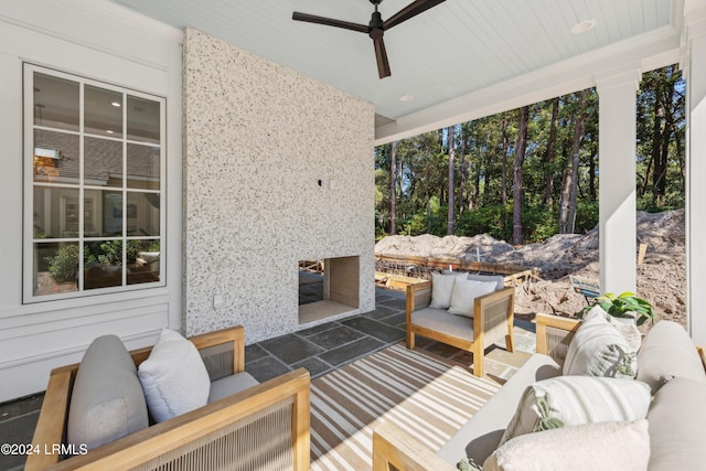 deck featuring an outdoor hangout area, a patio, and ceiling fan