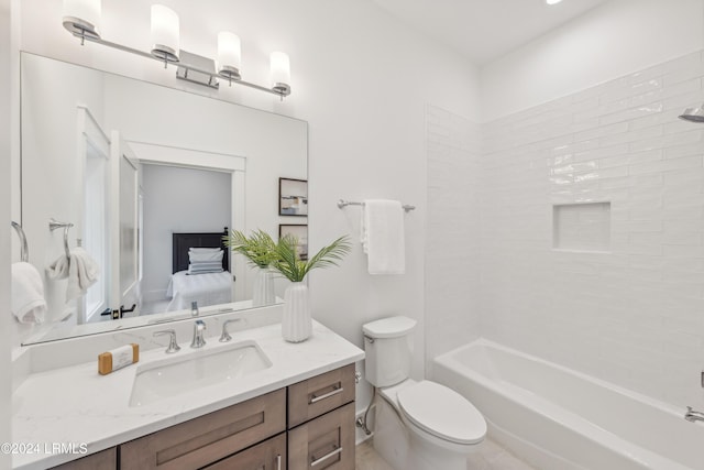 full bathroom with tiled shower / bath combo, vanity, and toilet