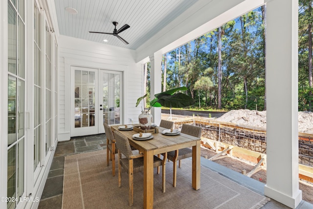 sunroom with ceiling fan, a healthy amount of sunlight, wood ceiling, and french doors