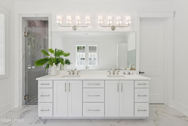 bathroom with vanity and a shower with door