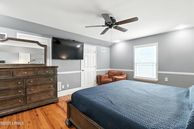 1 Broadland Cir, Bluffton, SC 29910 - bedroom featuring light wood-type flooring, wainscoting, and a ceiling fan