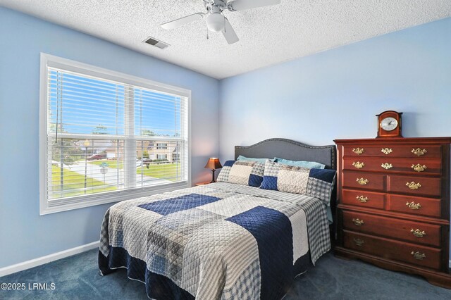 1 Broadland Cir, Bluffton, SC 29910 - bedroom with dark colored carpet, ceiling fan, and a textured ceiling