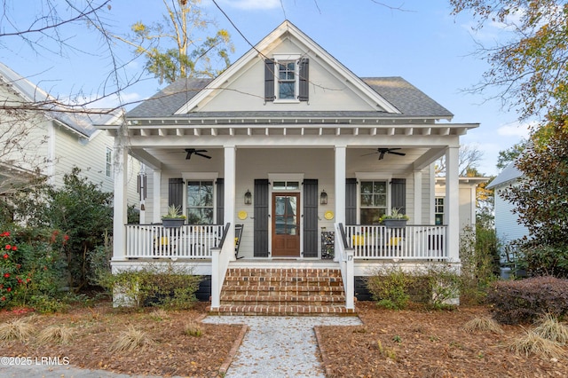 view of front of property with a porch, roof with shingles, and a ceiling fan