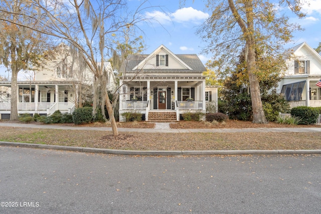 greek revival inspired property featuring covered porch