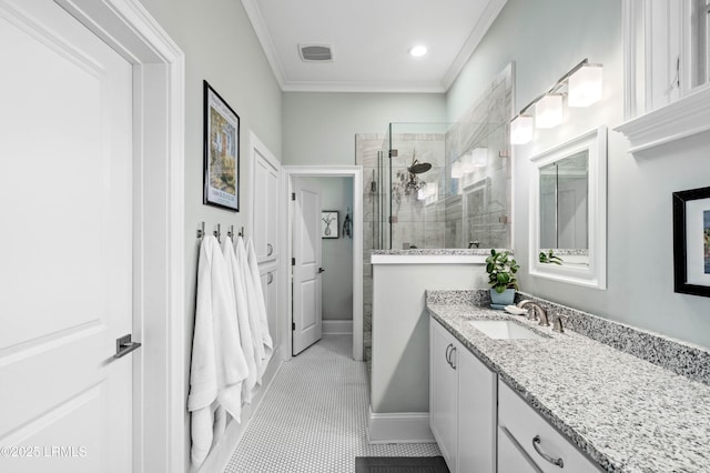 bathroom featuring tile patterned flooring, visible vents, vanity, walk in shower, and crown molding