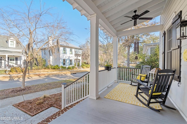 deck featuring a porch and a ceiling fan