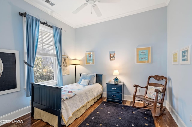 bedroom with baseboards, visible vents, ceiling fan, dark wood-type flooring, and crown molding