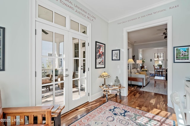 doorway featuring ceiling fan, baseboards, french doors, dark wood-style floors, and crown molding