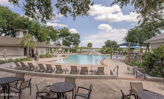 view of pool with a gazebo, pool water feature, and a patio