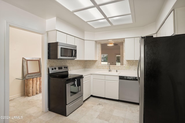 kitchen with white cabinetry, appliances with stainless steel finishes, and sink