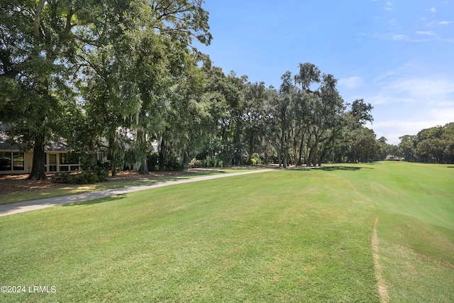 view of home's community featuring a lawn