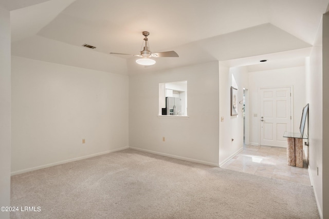 empty room featuring light carpet and ceiling fan