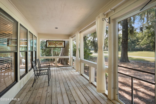 unfurnished sunroom with a wealth of natural light