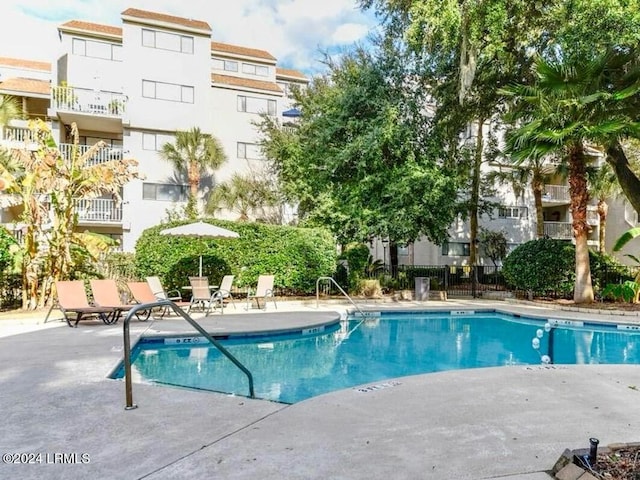 view of swimming pool featuring a patio area