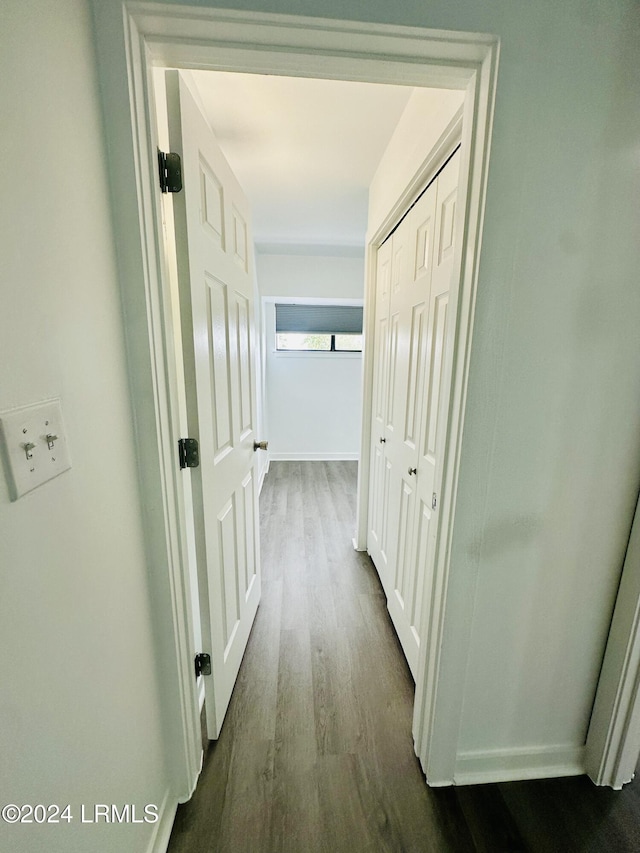 hall with dark hardwood / wood-style flooring