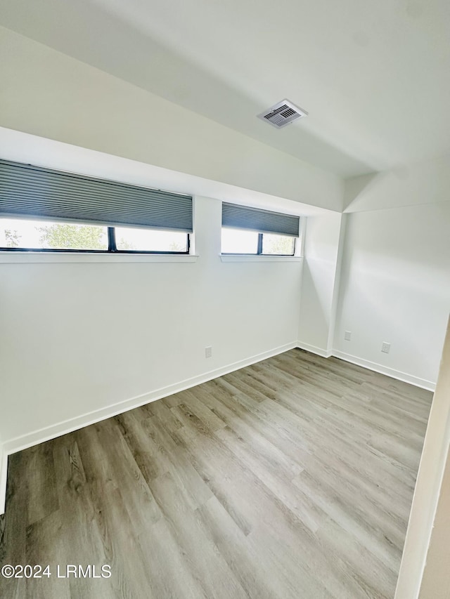 additional living space with light wood-type flooring