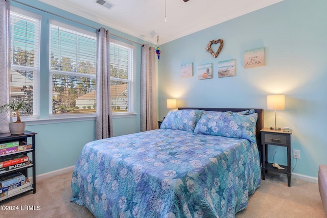 bedroom featuring light colored carpet