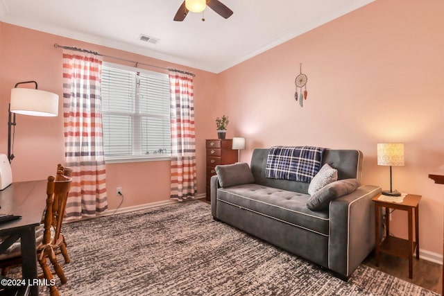 living room featuring ceiling fan and dark hardwood / wood-style flooring