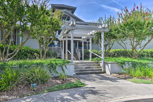 view of front of house with a pergola