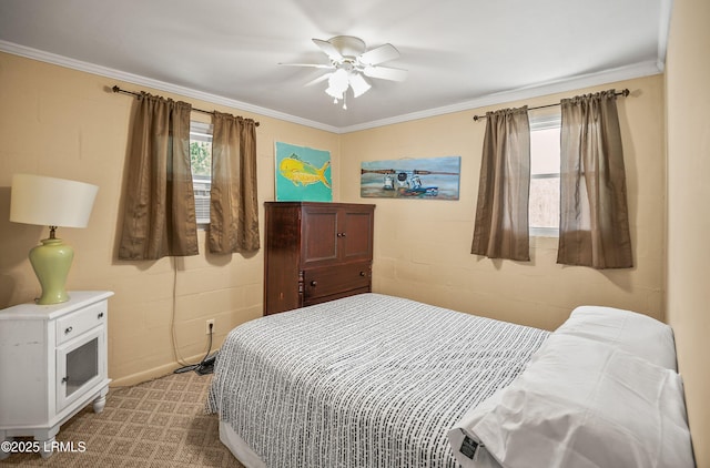 bedroom featuring crown molding and multiple windows