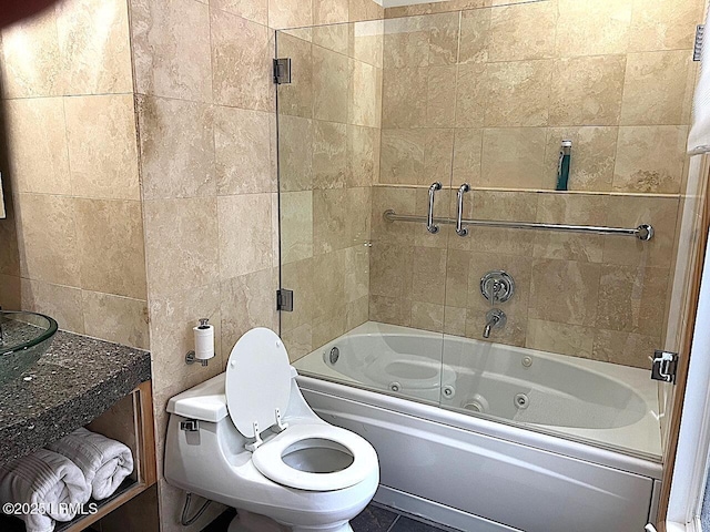 bathroom featuring a combined bath / shower with jetted tub and toilet