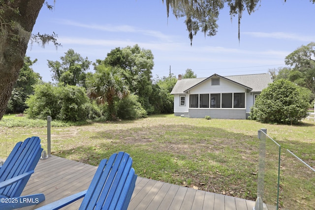 1413 Pigeon Point Rd, Beaufort, SC 29902 - view of grassy yard featuring a sunroom