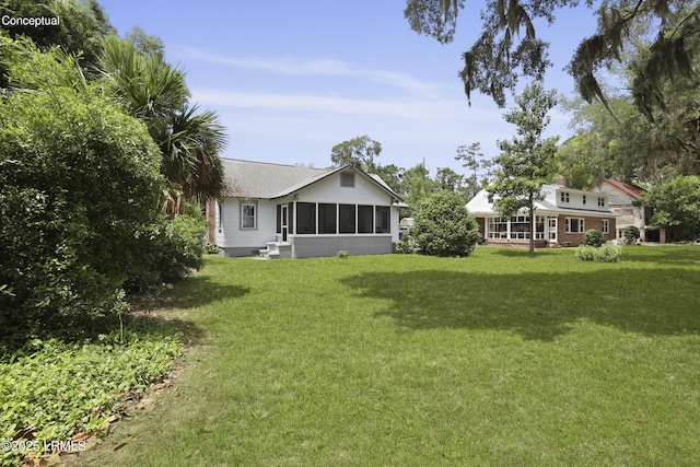 1413 Pigeon Point Rd, Beaufort, SC 29902 - view of grassy yard featuring a sunroom