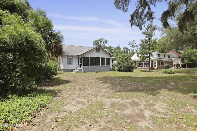 1413 Pigeon Point Rd, Beaufort, SC 29902 - view of green lawn featuring a sunroom