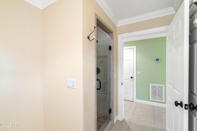 104 Barnaby Blf, Seabrook, SC 29940 - bathroom featuring crown molding, a shower stall, and tile patterned floors