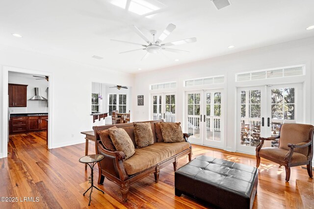 104 Barnaby Blf, Seabrook, SC 29940 - living area featuring french doors, a ceiling fan, ornamental molding, light wood-style flooring, and recessed lighting