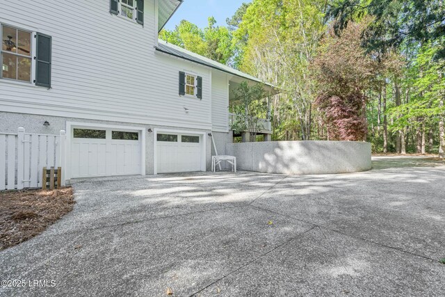 104 Barnaby Blf, Seabrook, SC 29940 - view of property exterior featuring an attached garage and driveway