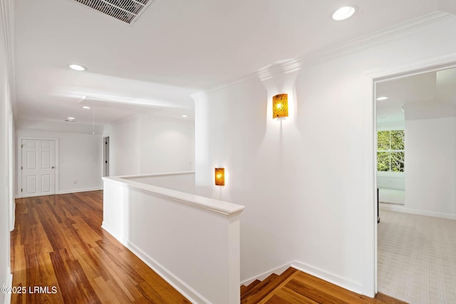 104 Barnaby Blf, Seabrook, SC 29940 - hall featuring an upstairs landing, attic access, recessed lighting, ornamental molding, and light wood-type flooring