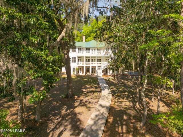 104 Barnaby Blf, Seabrook, SC 29940 - rear view of house with french doors, stairway, and a metal roof