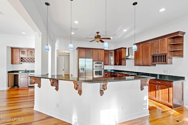 104 Barnaby Blf, Seabrook, SC 29940 - kitchen featuring stainless steel appliances, wall chimney exhaust hood, open shelves, light wood-style flooring, and recessed lighting